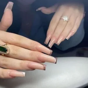 Carefully placed crystal accents add a beautiful sparkle to this glamorous nail design while maintaining an elegant finish.