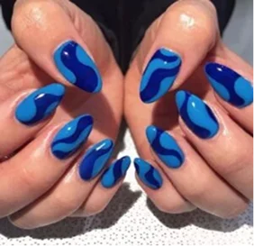 Bold red nails with a flawless glossy finish create a confident, timeless look inspired by classic beauty.