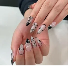 Elegant gold details add a luxurious touch to this sophisticated manicure, perfect for special occasions and celebrations.